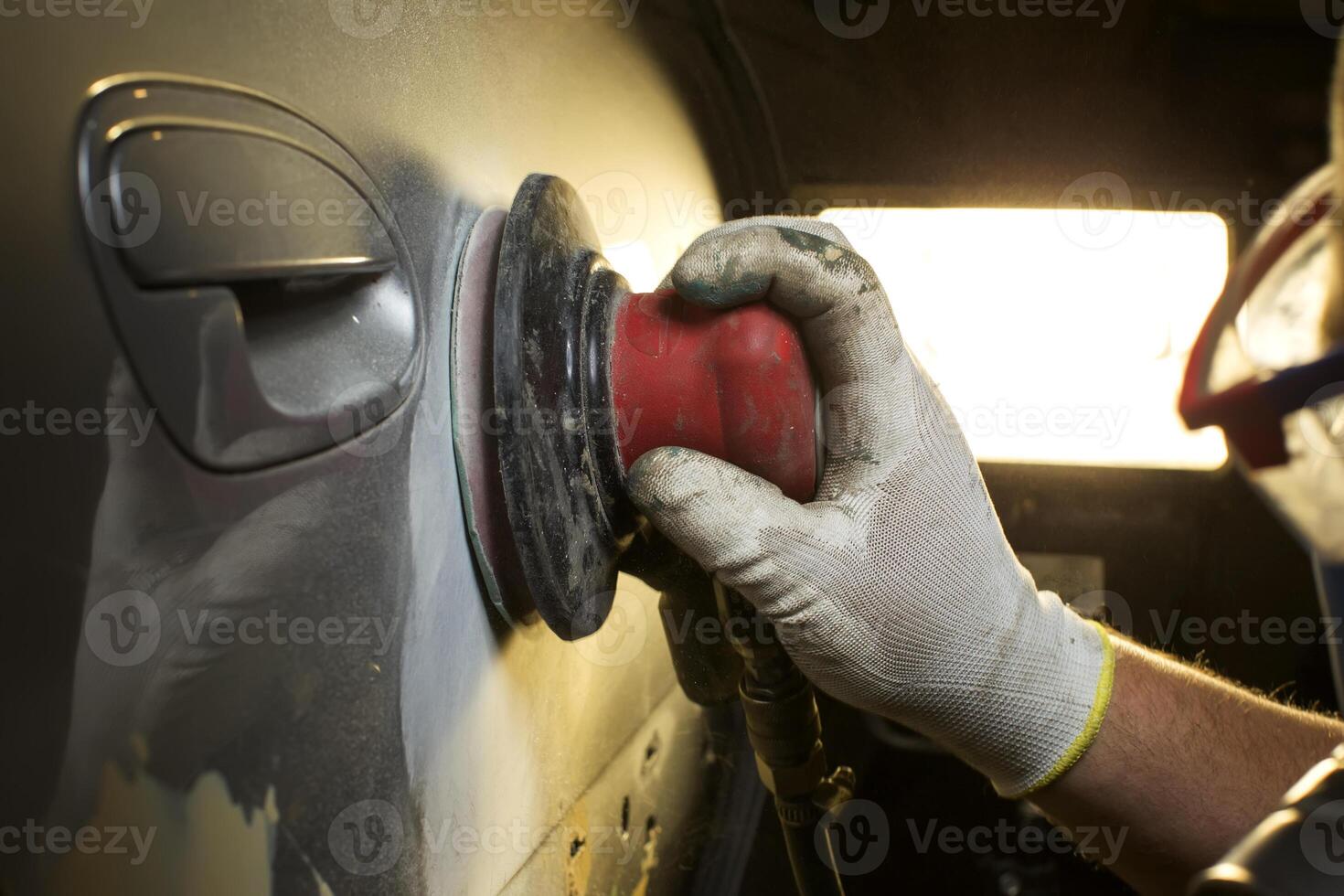 Hands grind polish the car. Car body repair photo