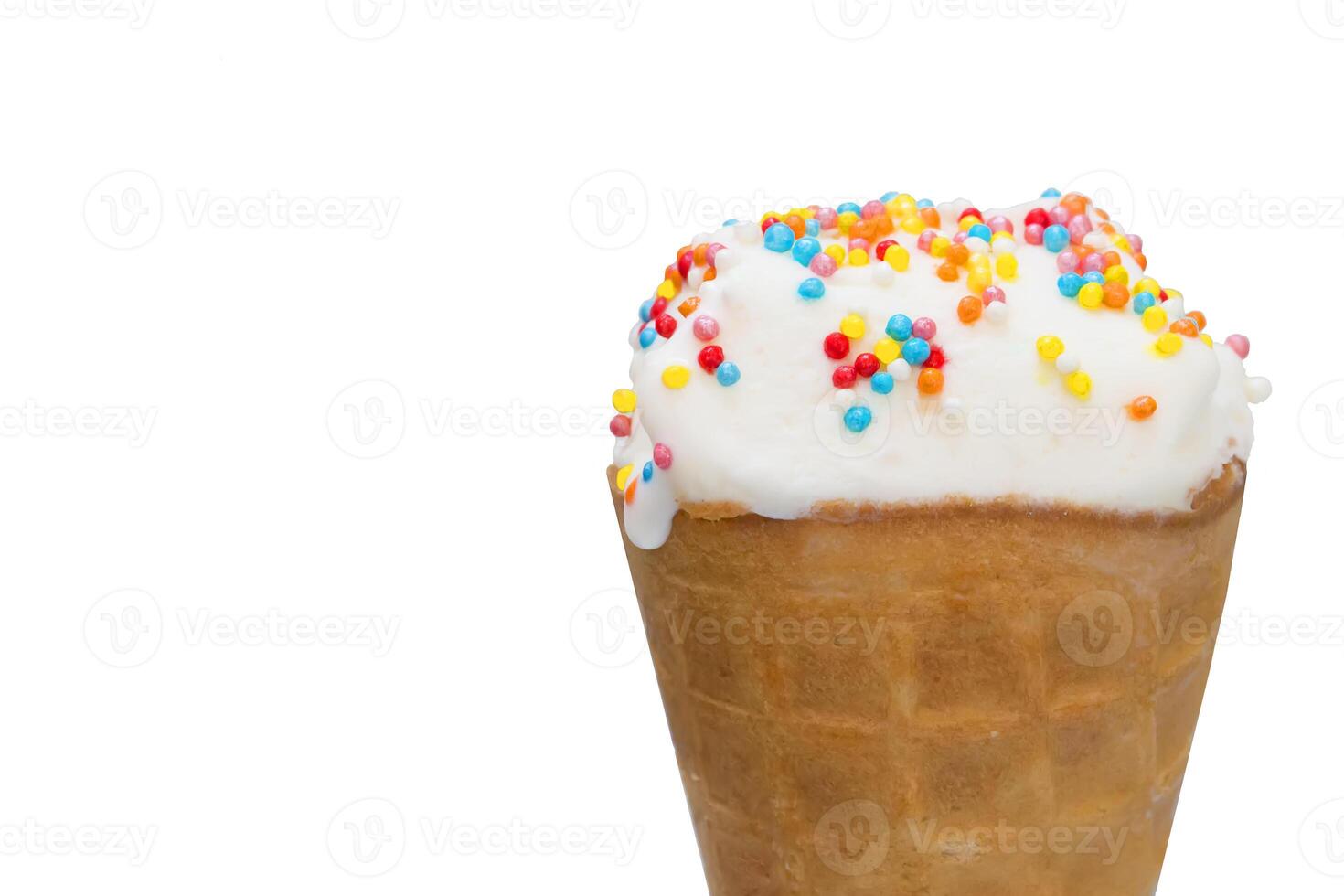 Ice cream close up on white background. White ice cream scoop in a waffle cone on a blue background. Sweet dessert decorated with multicolored sprinkles photo