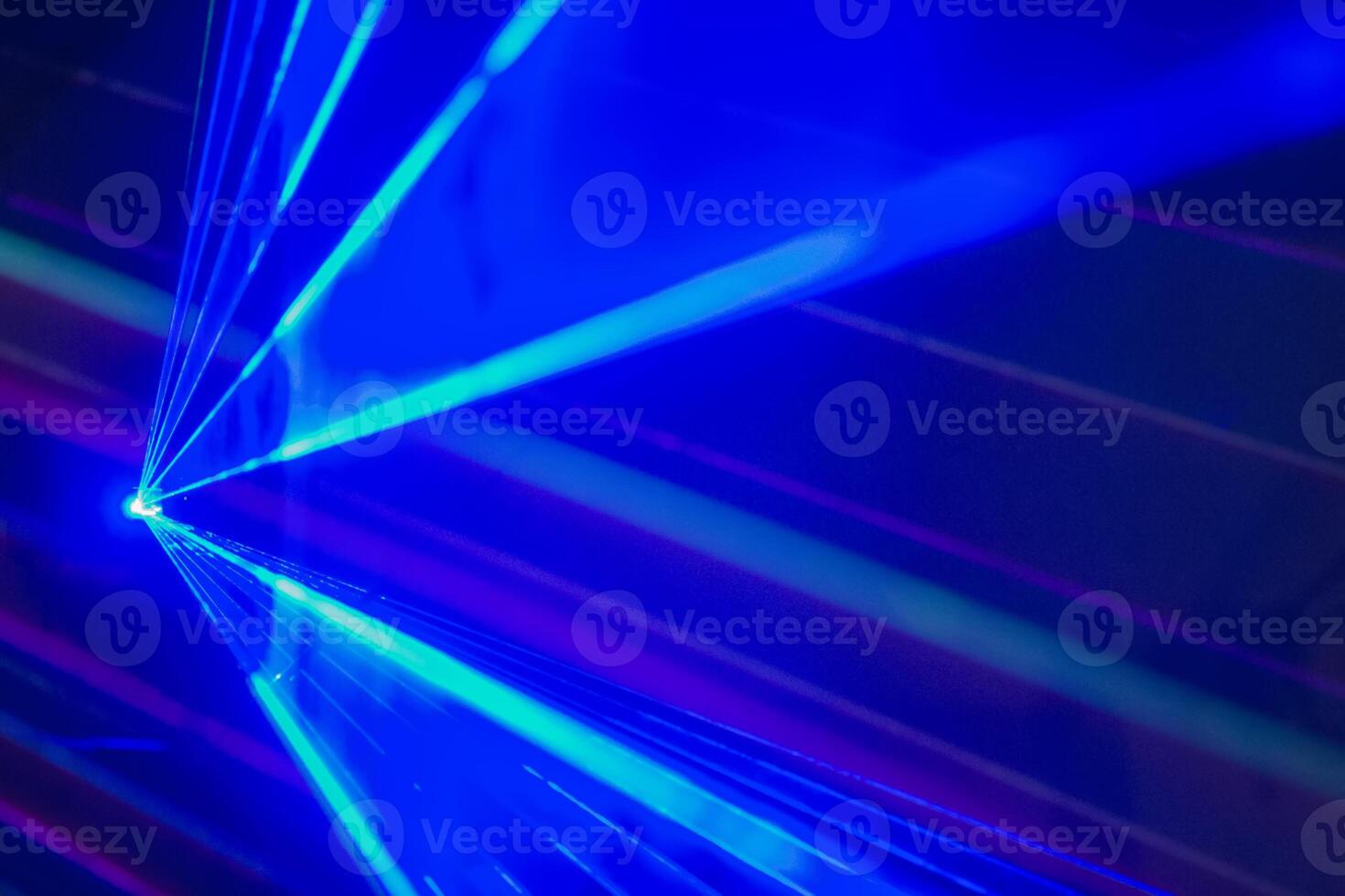 Laser beam on blue background photo