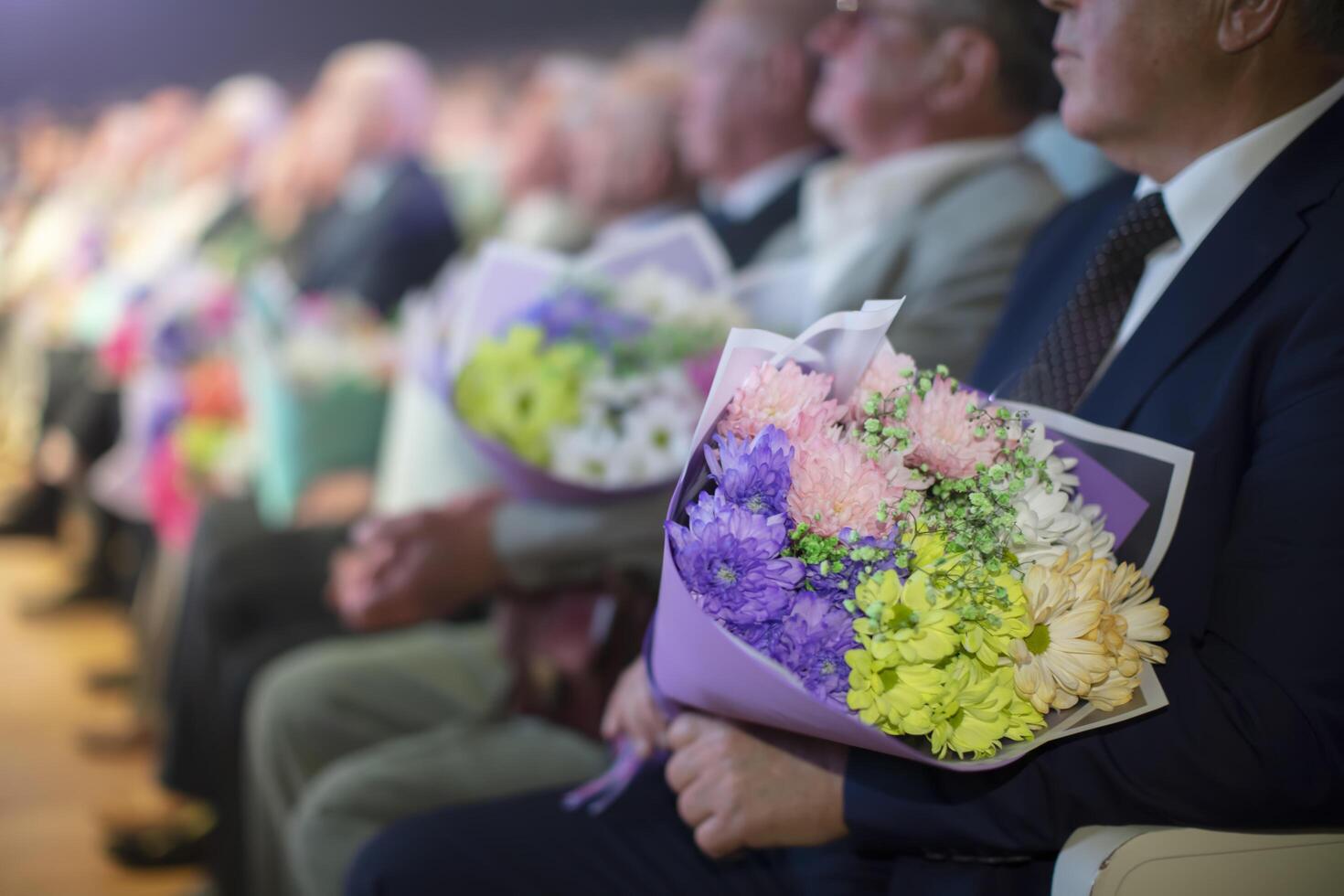 June 16, 2023. Belarus, Gomel. Public event. Spectators in the hall with flowers. photo