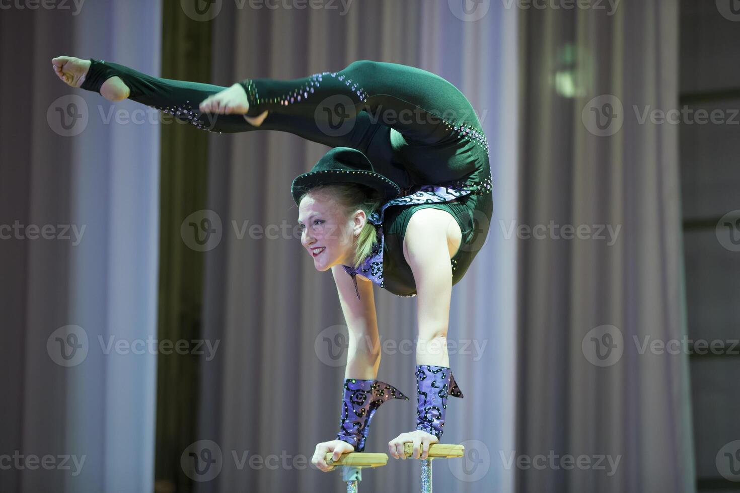 Belarus, Gomel, July 4, 2018. Indicative training circus school.Acrobatic performance of the actress.Girl with a flexible body.Balancing act photo