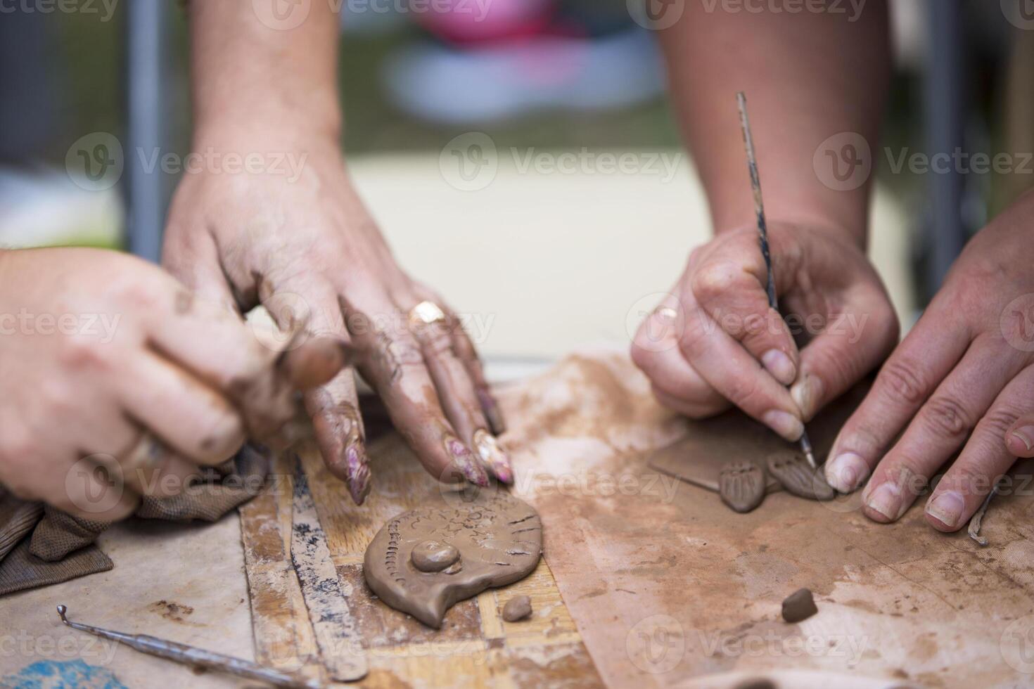 Hands make crafts from clay. Sculpt photo