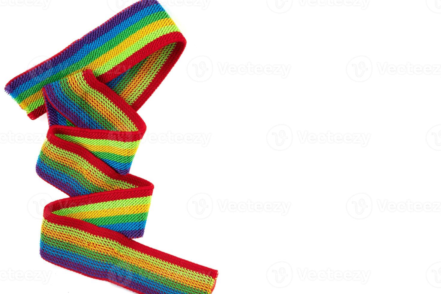 Colorful rainbow ribbon closeup isolated on white background. Colorful LGBT design. Curly, fluttering ribbon. photo