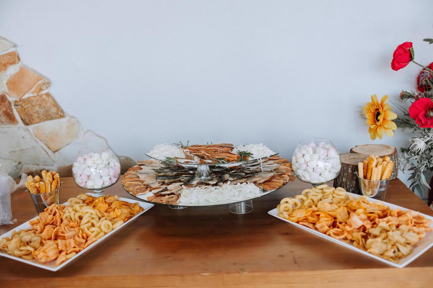 Meat and cheese snacks on the buffet. A buffet in a closed room, at a wedding celebration or birthday. Sandwiches on skewers before the start of the holiday. photo