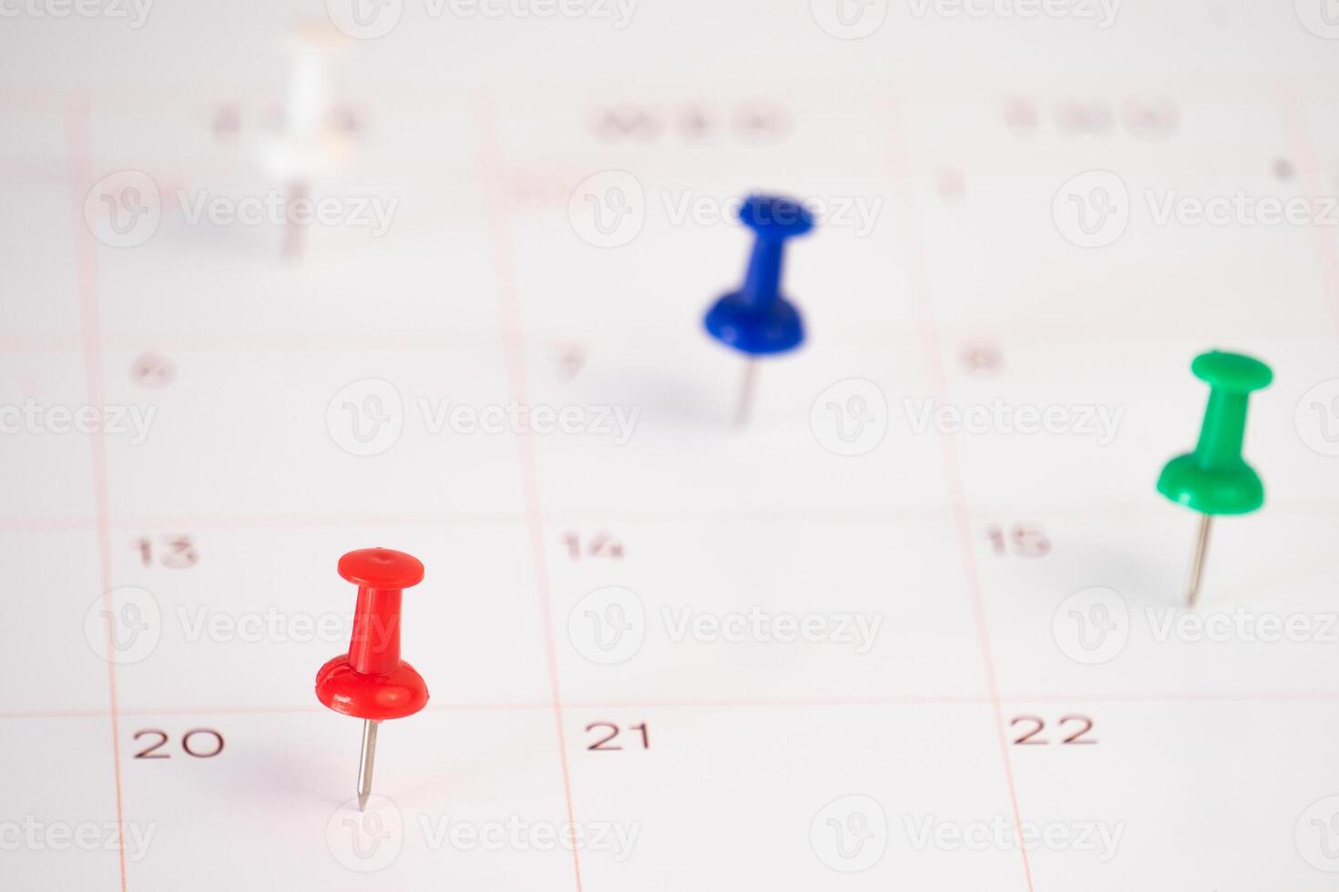 close up of a calendar with pin photo