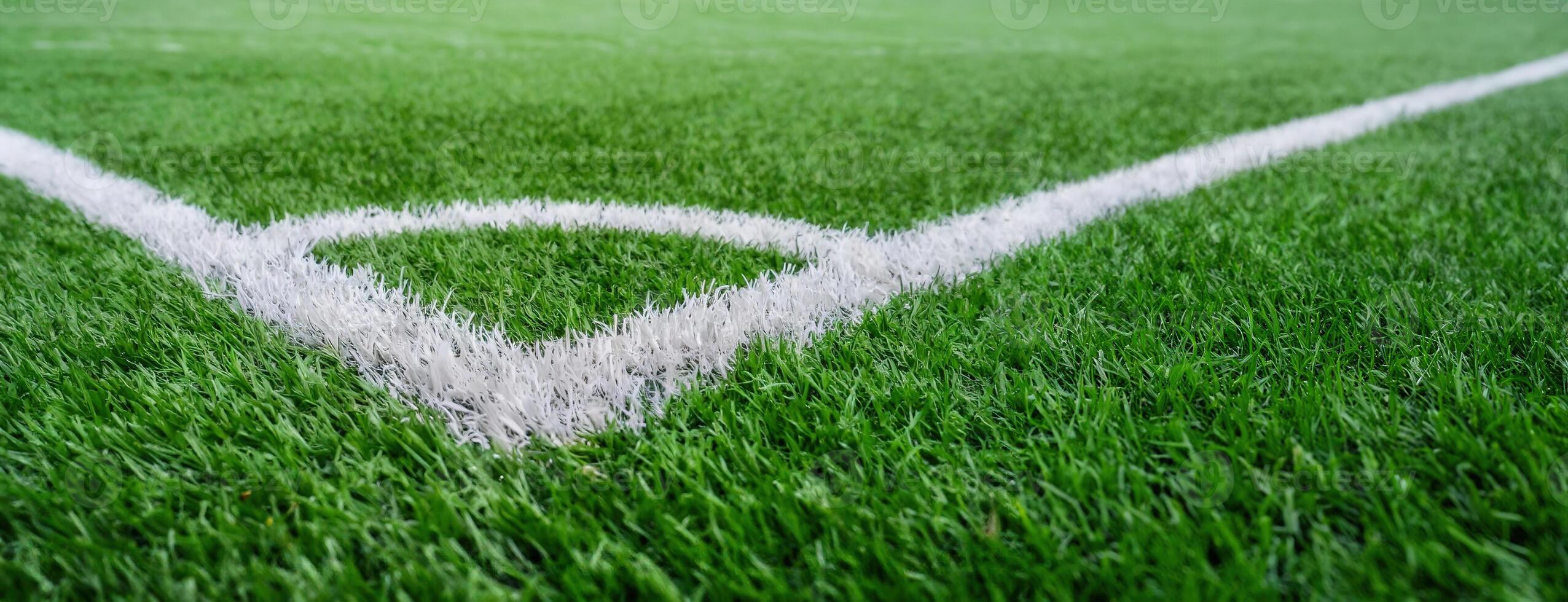 AI Generated Close-up of a soccer field corner line. The lush green of pitch is shown in close detail. Ready for a football match. Panorama with copy space. photo