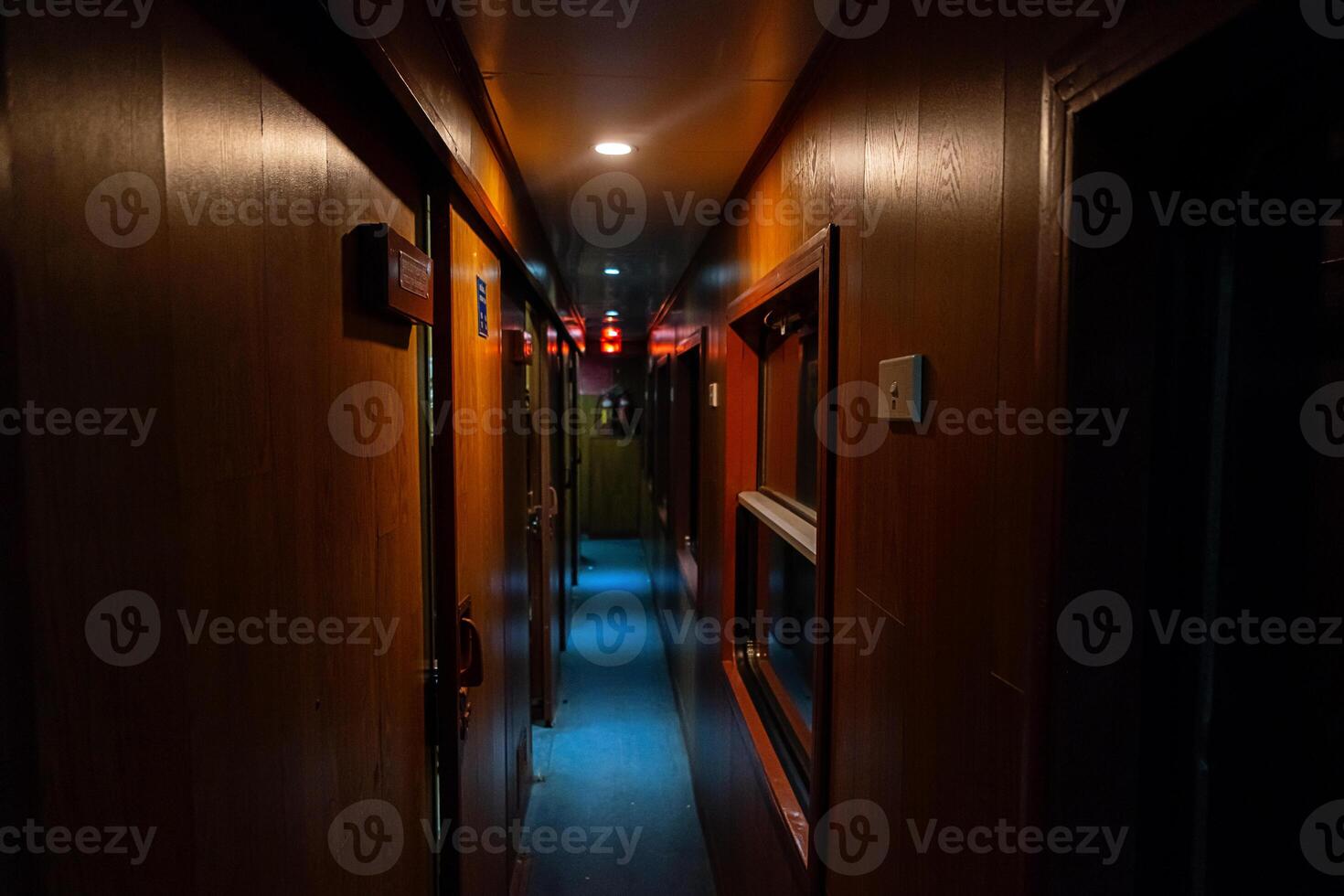 Empty hallway in old sleeping wagon of train at night. photo