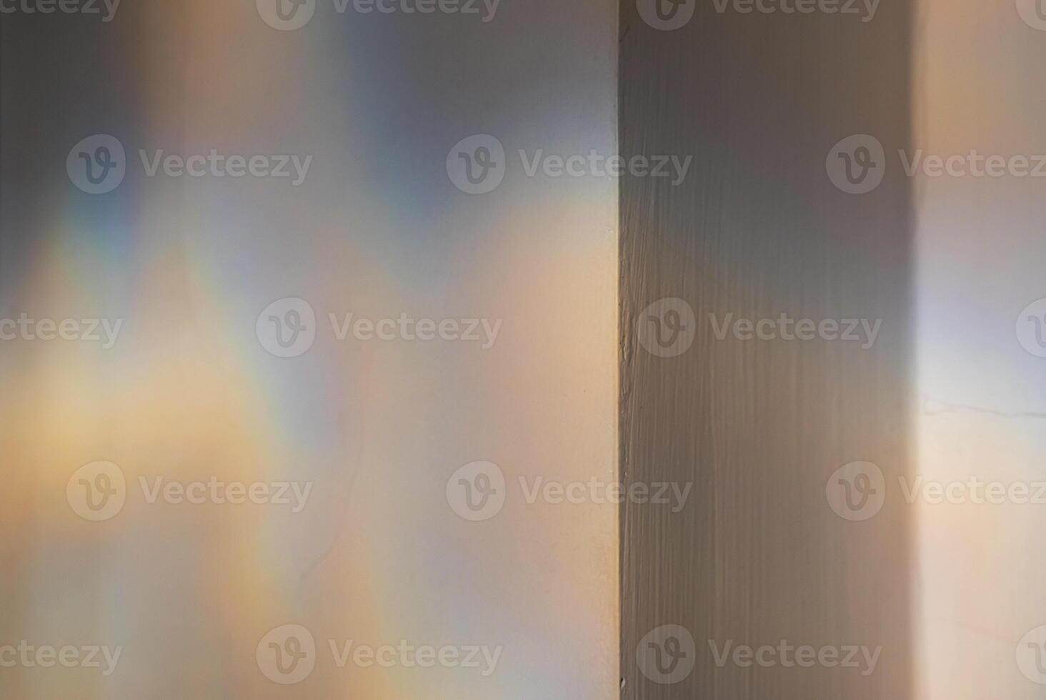 Reflected colourful light patterns on the wall. photo