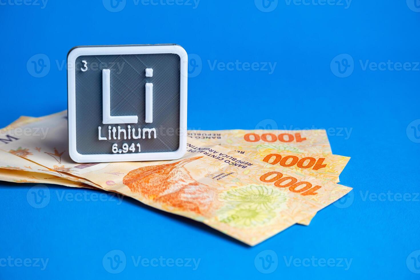 Thousand Argentine peso bills with lithium symbol logo. photo