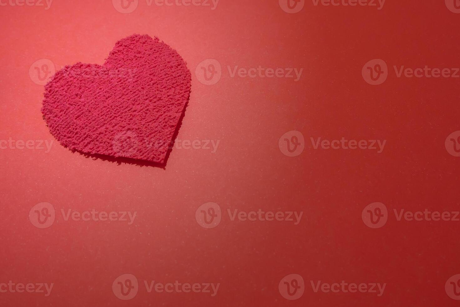 Beautiful heart on a red background photo