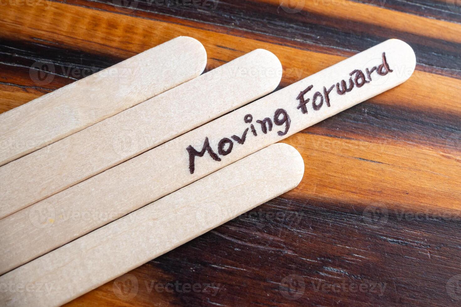 Always moving forward concept made with ice cream sticks. photo