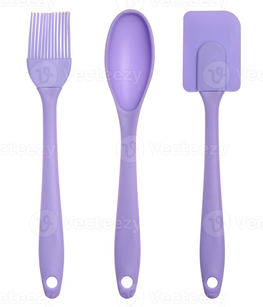 Silicone spoon, spatula and brush for eating on isolated background photo