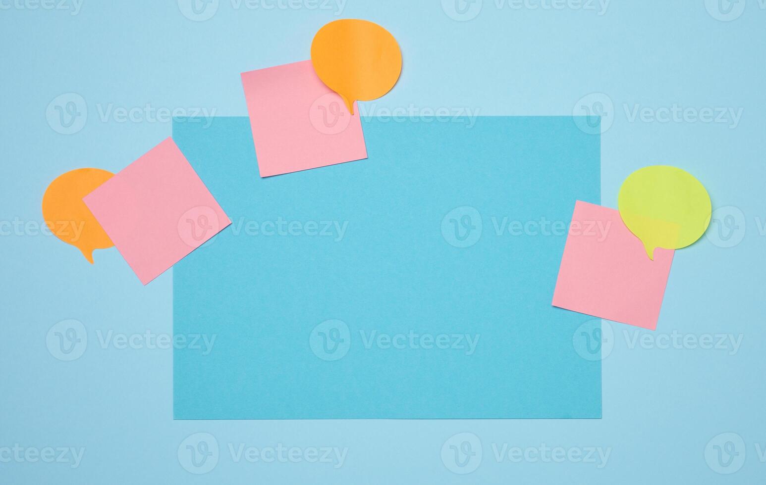 Blank rectangular sheet of paper on a blue background photo