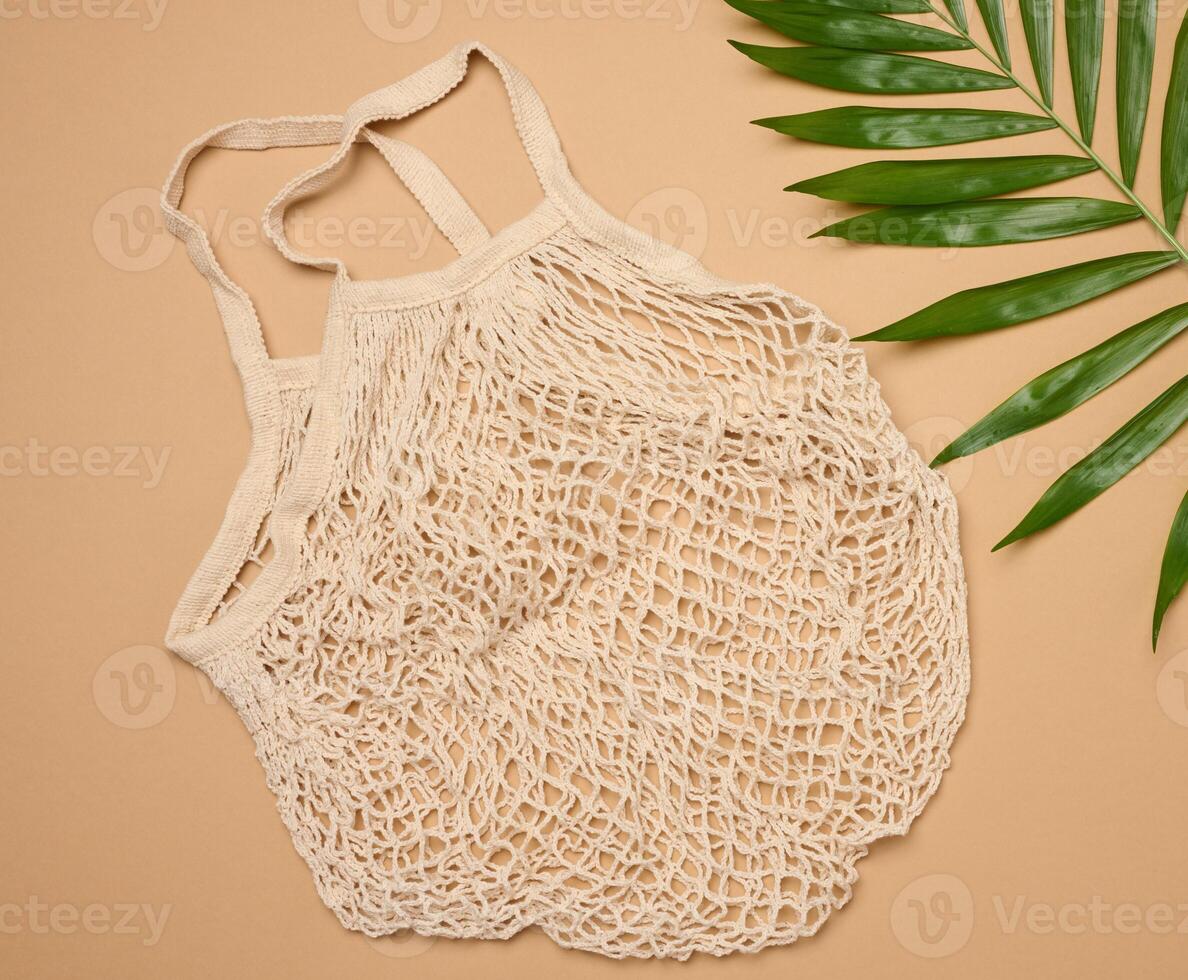 Textile grocery bag on brown background photo