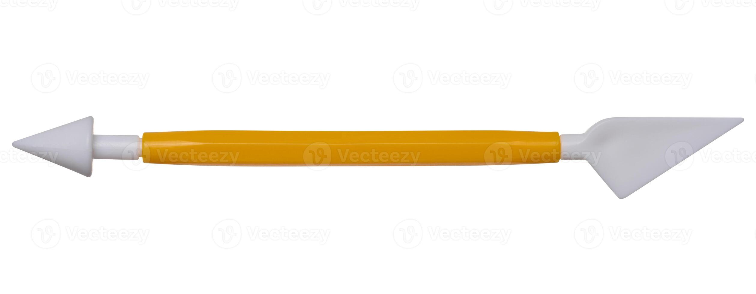 Plastic spatula for modeling plasticine on an isolated background photo