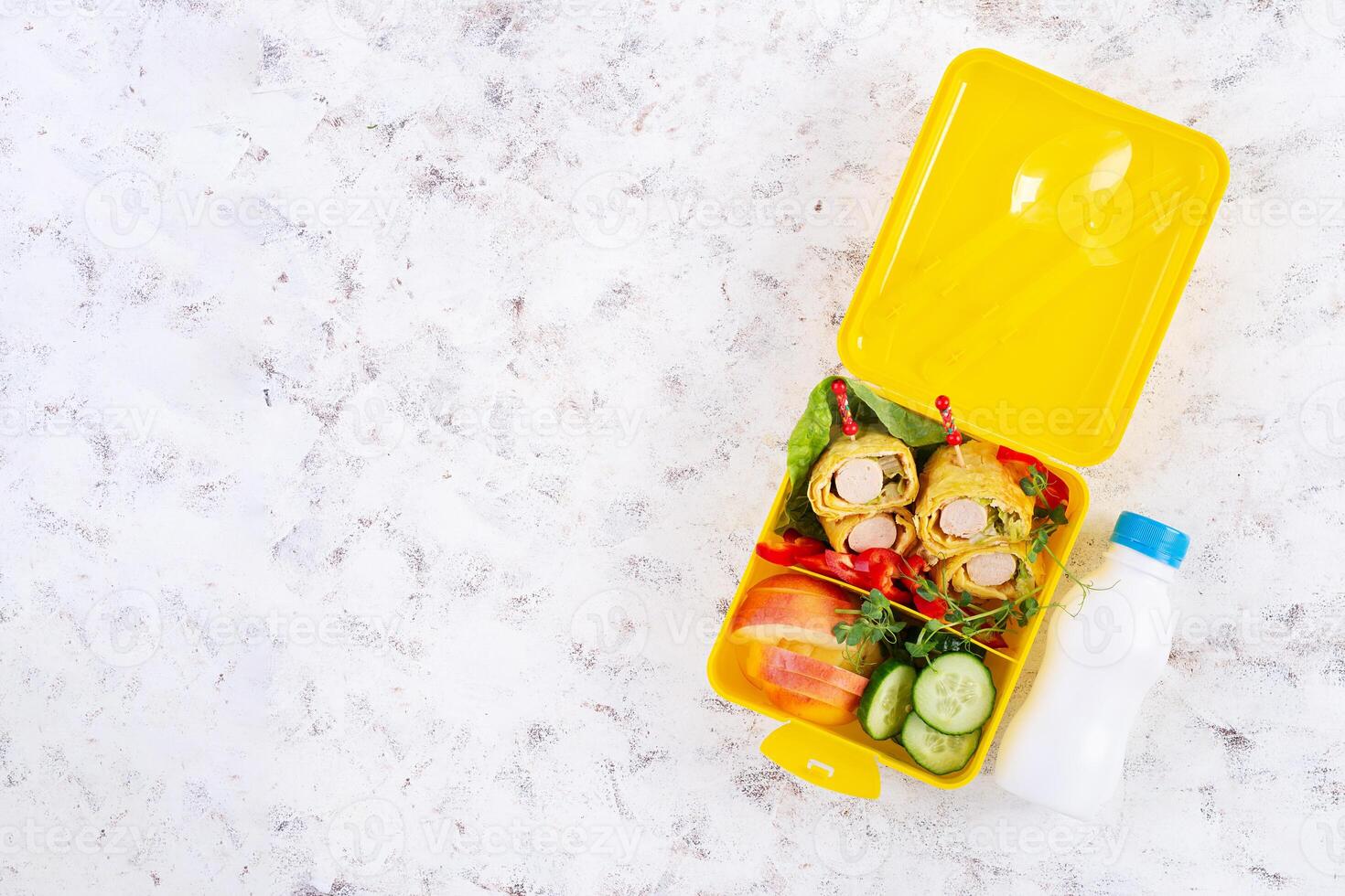 School lunch box with sausage roll in omelette with lavash. Lunchbox. Keto lunch. Top view, flat lay photo