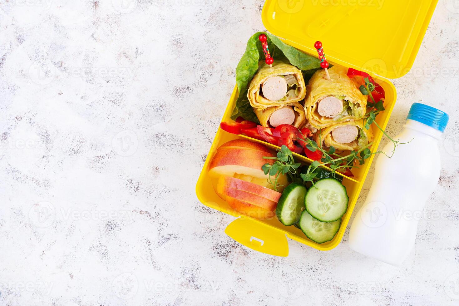 School lunch box with sausage roll in omelette with lavash. Lunchbox. Keto lunch. Top view, flat lay photo