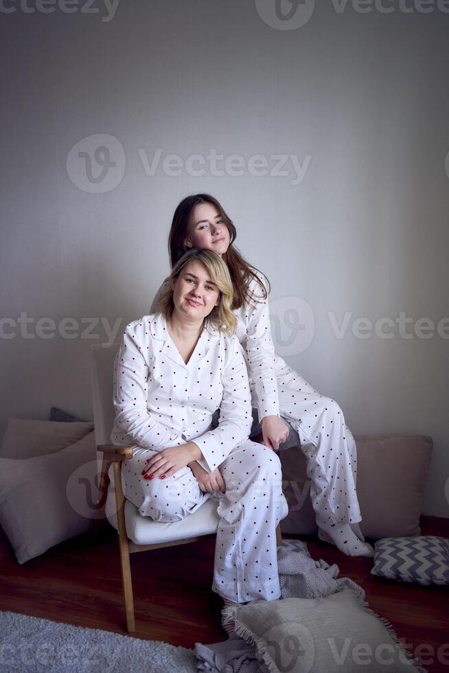 a portrait of a beautiful woman of medium size with a teenage daughter in a minimalist style photo