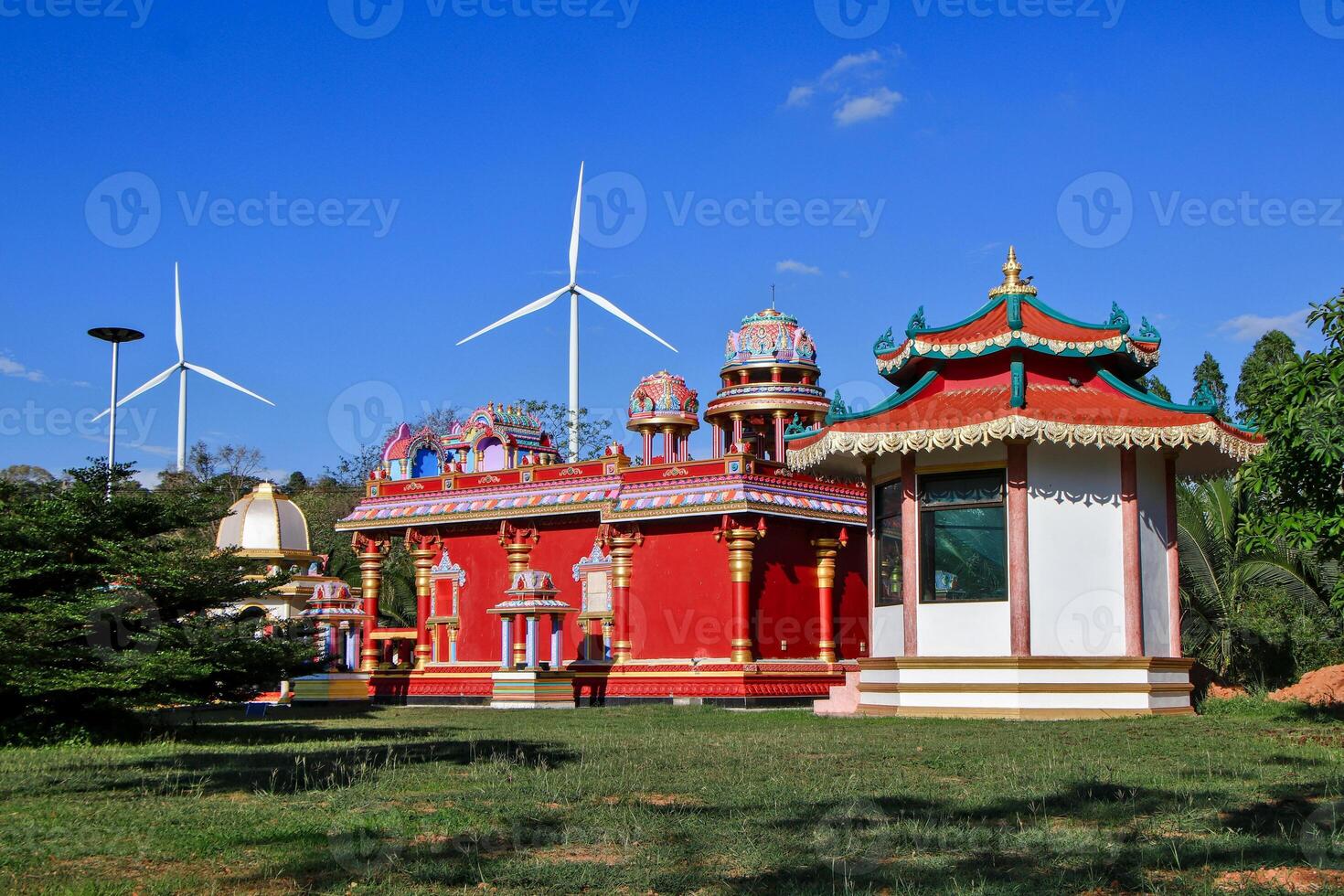 Religious sites and the environment coexist with wind turbine technology. photo
