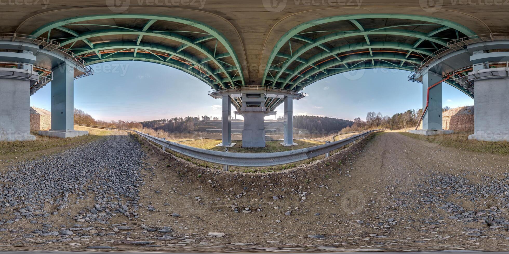 hdri 360 panorama on gravel road under steel frame construction of huge car bridge across river  in equirectangular full seamless spherical projection. VR  AR content photo