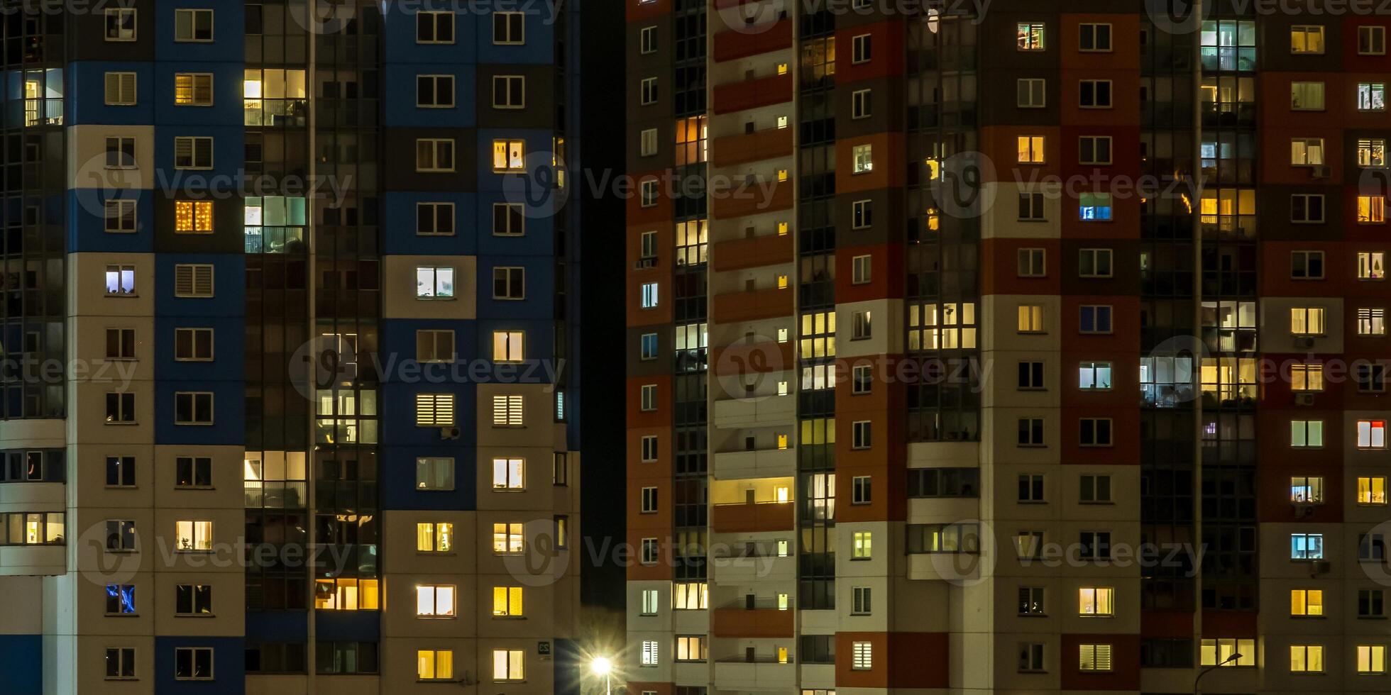 with light in windows of multistory buildings at night. life in a big city. Serenade of light photo