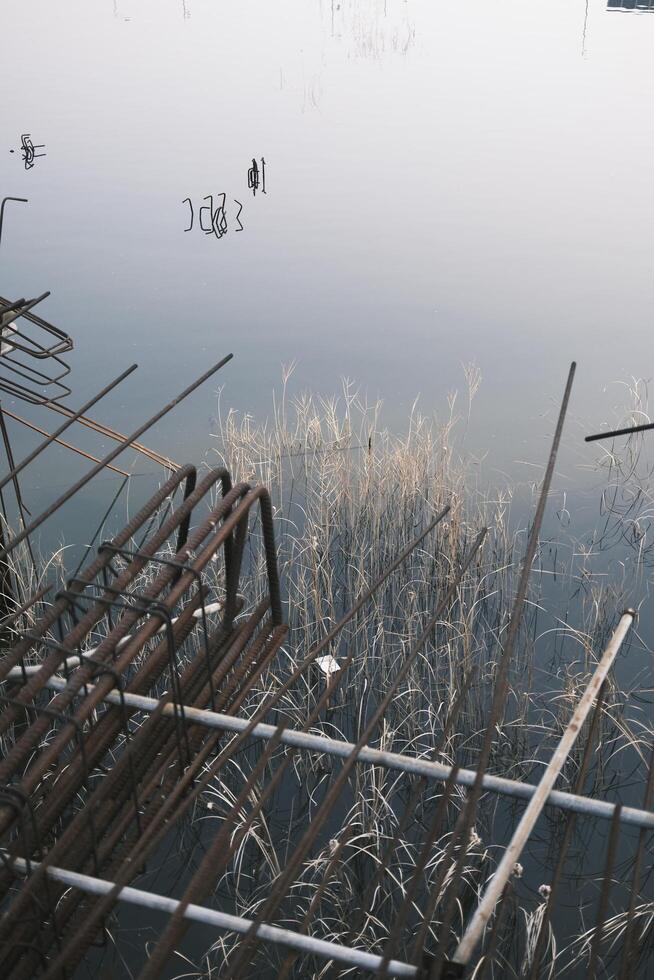 The foundation of an unfinished building filled with water photo
