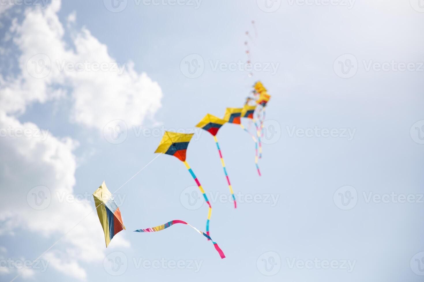 Colorful Kites in Sync Flying photo