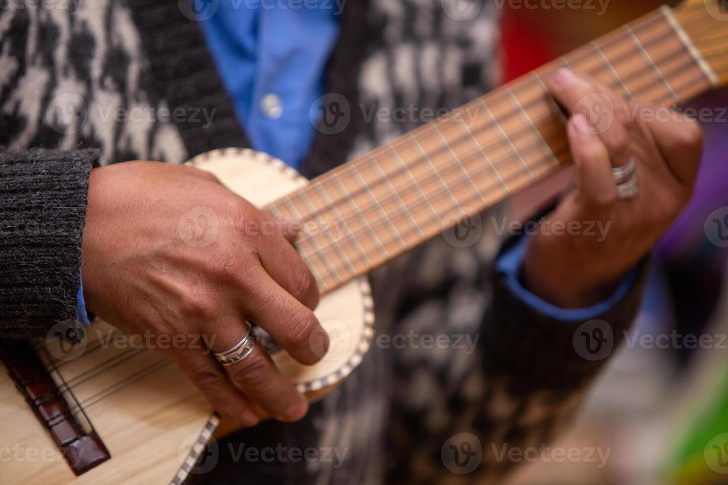 Man playing Guitar photo