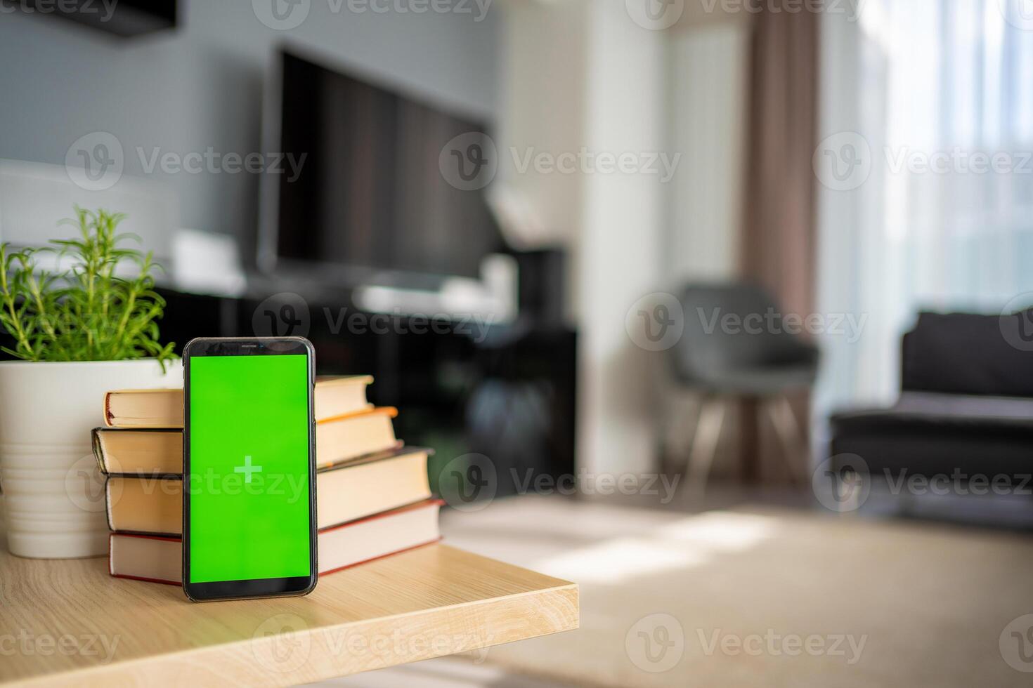 Digital detox concept. In the foreground is a smartphone with green chroma key screen. High quality photo