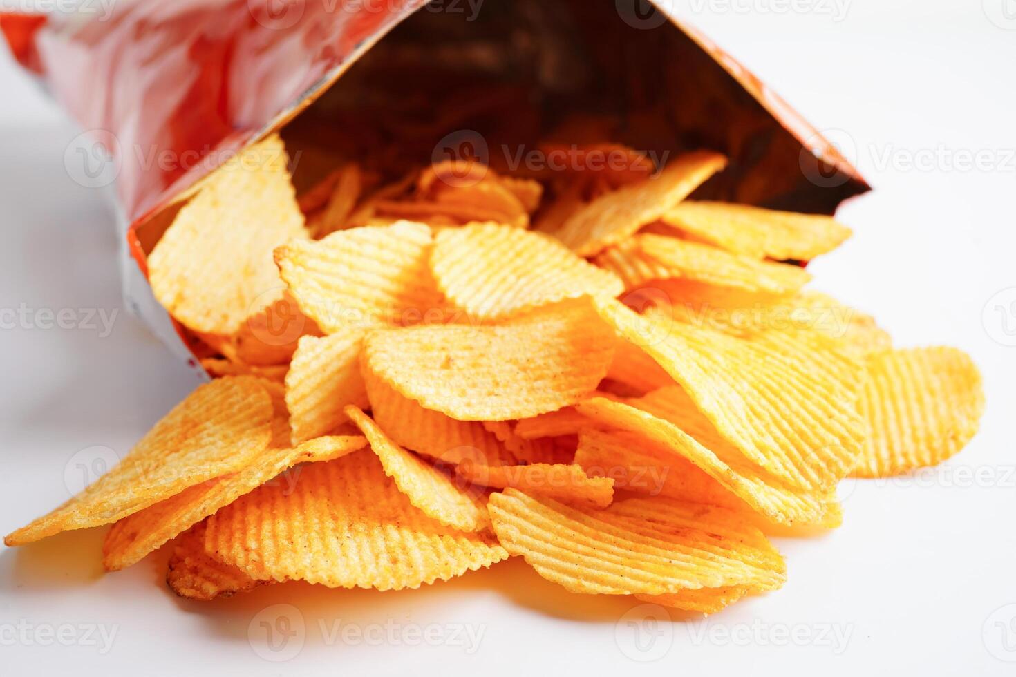 Potato chips in open bag, delicious BBQ seasoning spicy for crips, thin slice deep fried snack fast food. photo