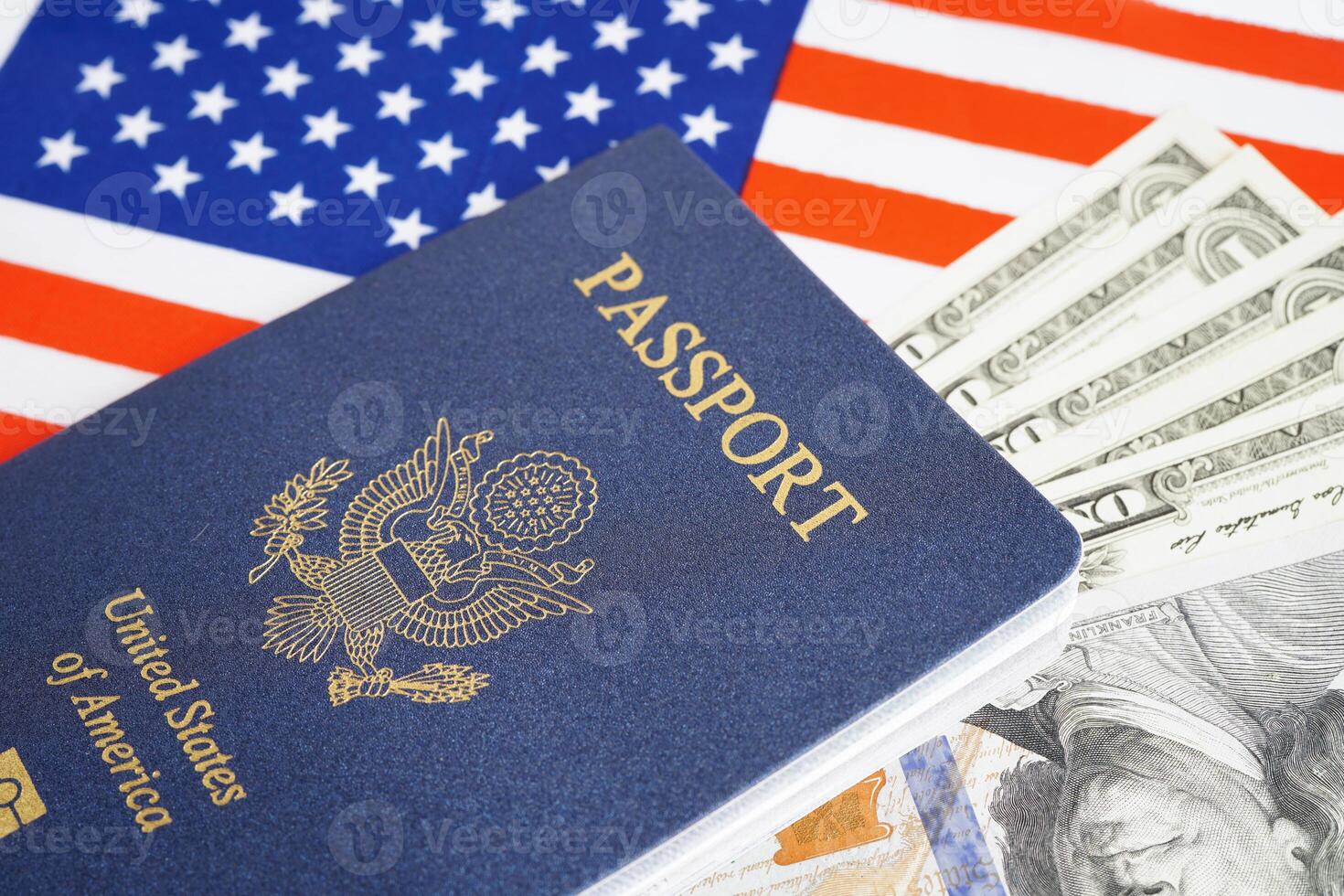 US passport with dollar money on USA flag, American citizen in United States of America. photo