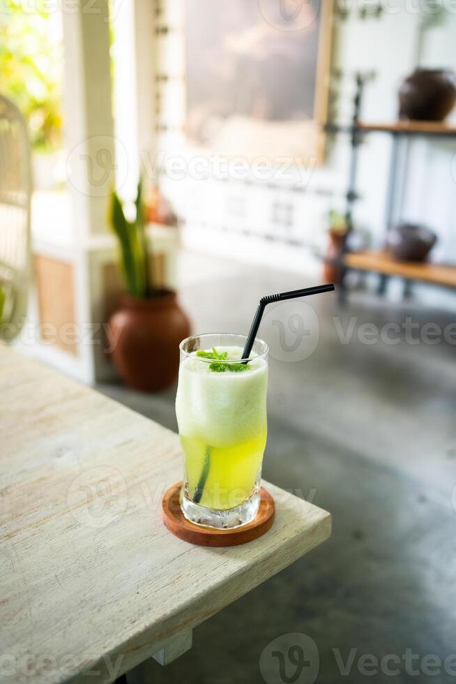 fresh cold melon juice on a table in an elegant cafe. photo