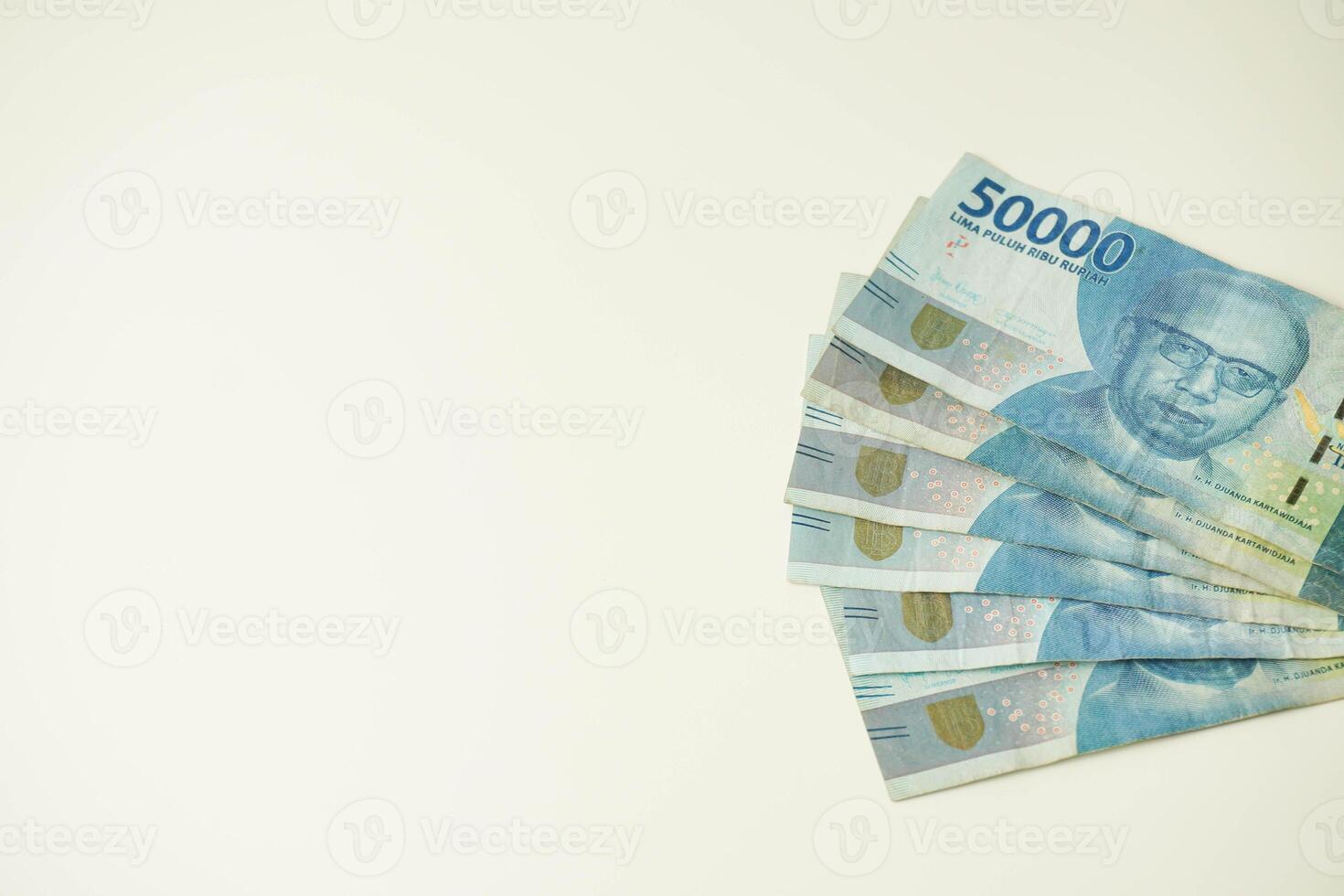 pile of indonesian money Rupiah on white background. fifty thousand photo