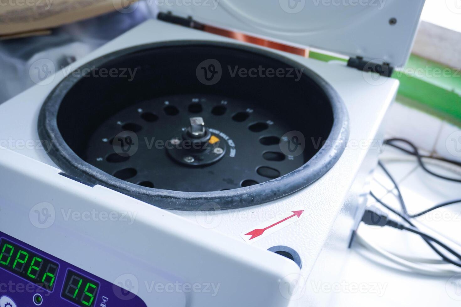 Laboratory equipment. Open laboratory centrifuge. White medical centrifuge with digital panel. Device for laboratory research. Modern lab technologies photo
