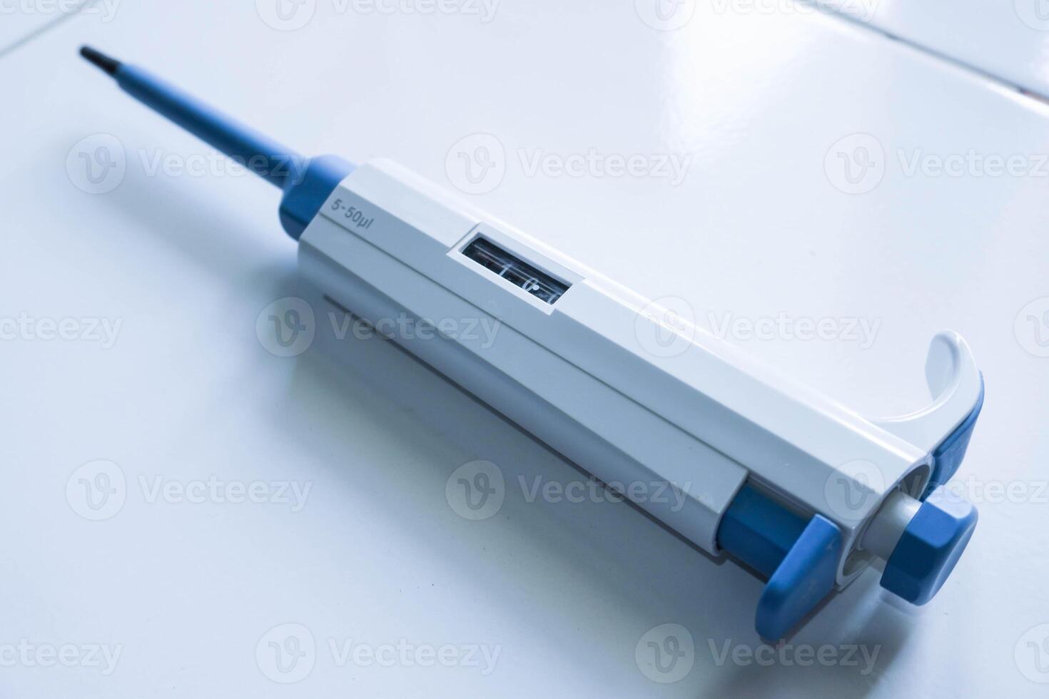 Automatic pipette, Micro pipettes, Micro chemical equipment laboratory Isolated on white table background photo