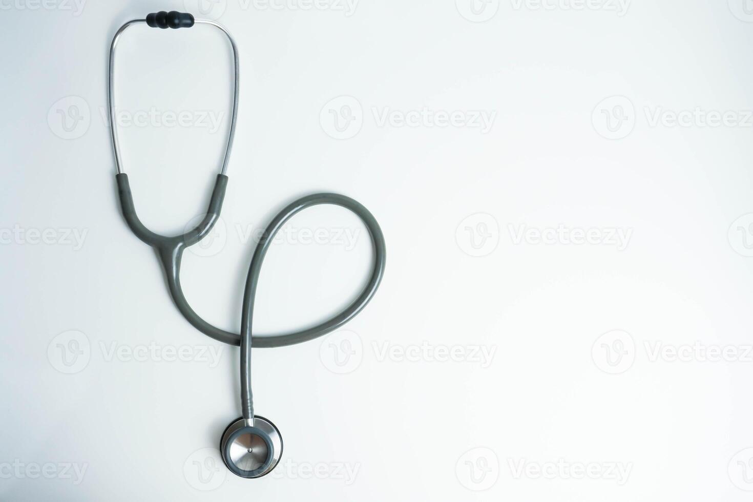 Stethoscope isolated on white background, top view. Medical tool. Health care concept photo