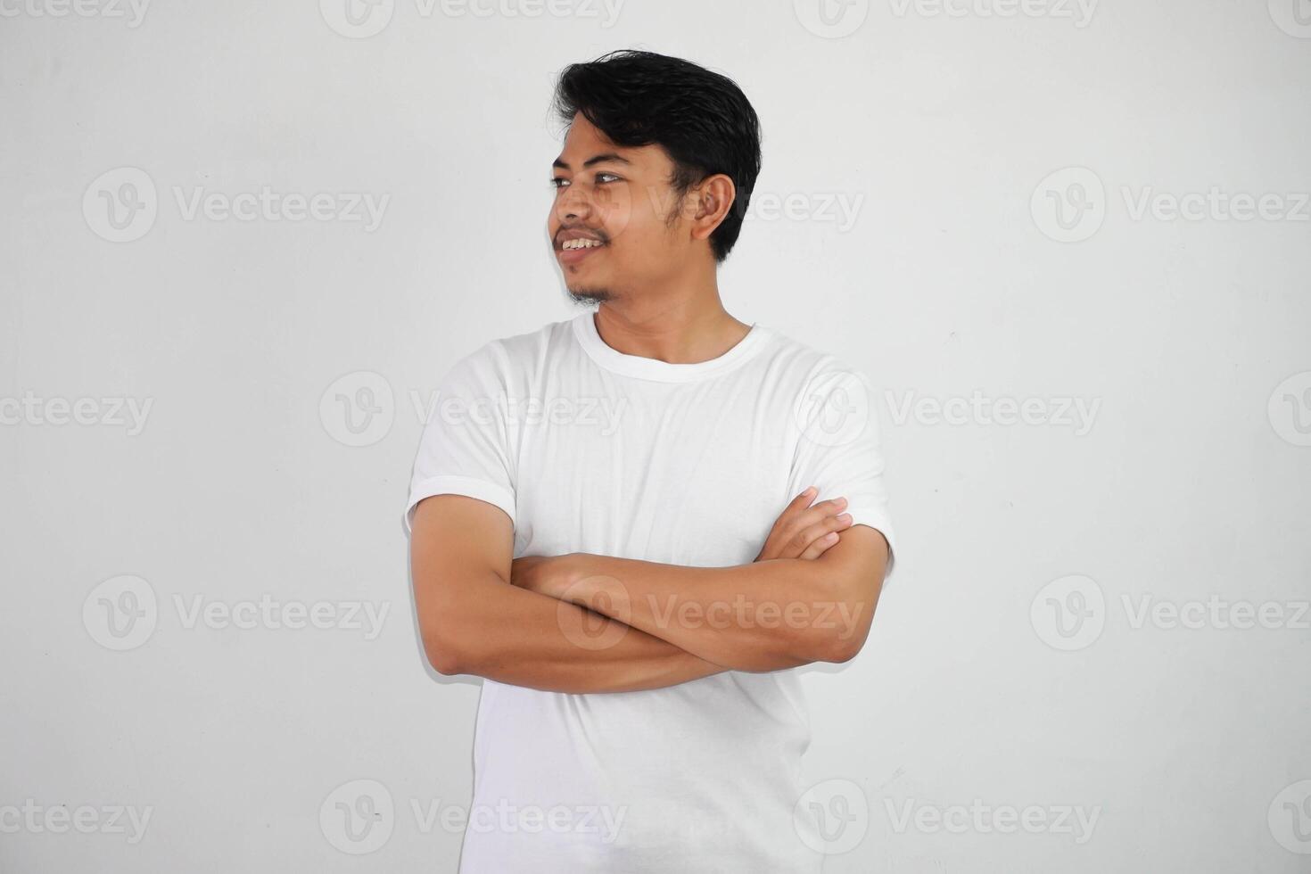 smile or happy asian man crossed arms wearing white t shirt isolated on white background photo