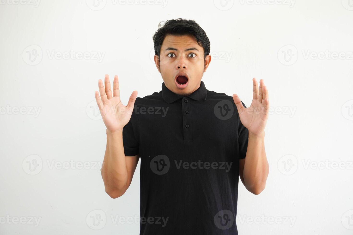 Amazed excited young asian man looking at camera with wow face expression feeling surprised advertising shopping promotion, unbelievable betting win standing isolated on white background. photo