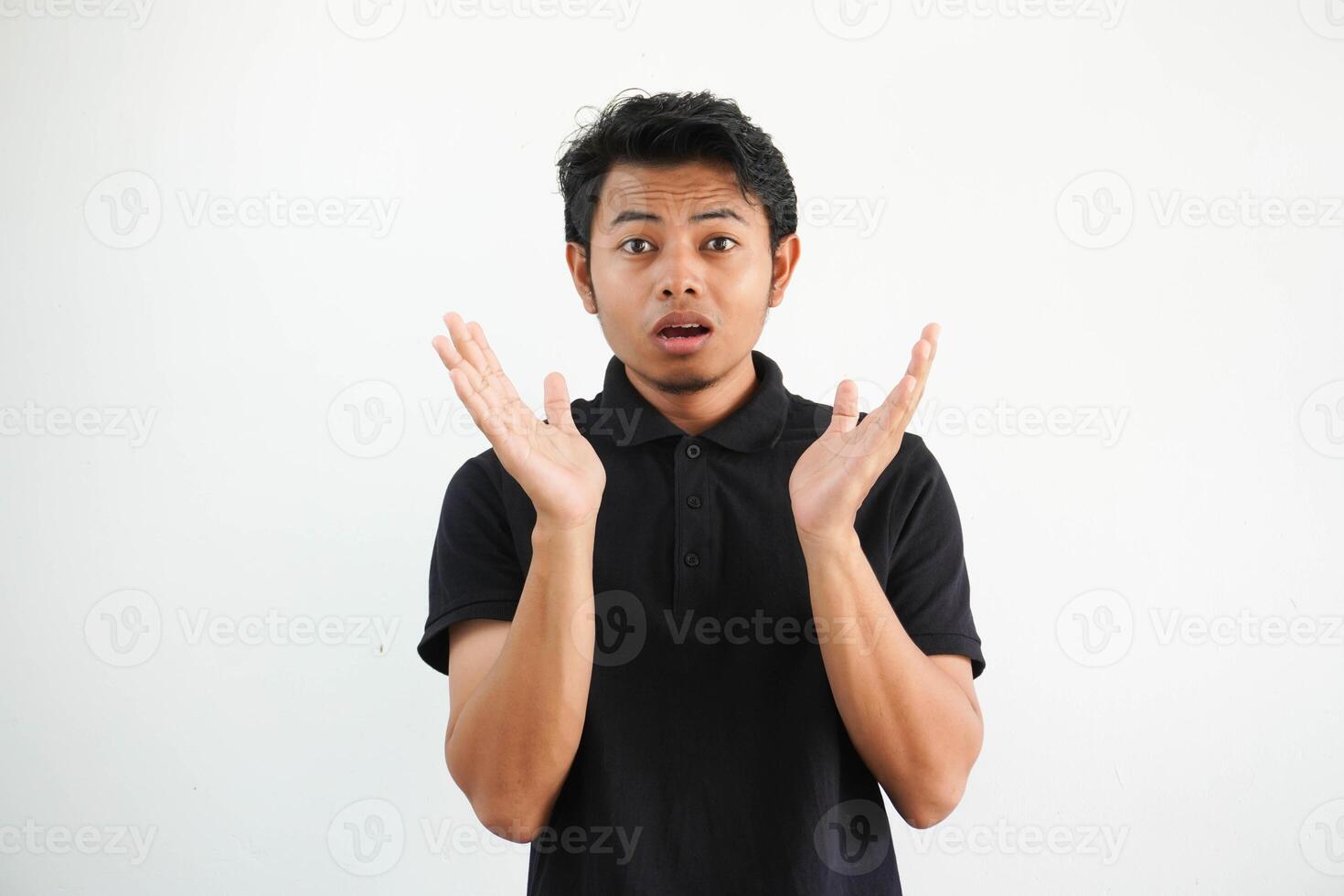 Amazed excited young asian man looking at camera with wow face expression feeling surprised advertising shopping promotion, unbelievable betting win standing isolated on white background. photo