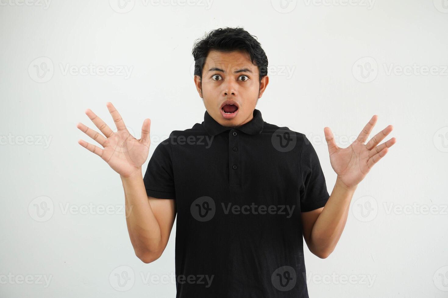 Amazed excited young asian man looking at camera with wow face expression feeling surprised advertising shopping promotion, unbelievable betting win standing isolated on white background. photo