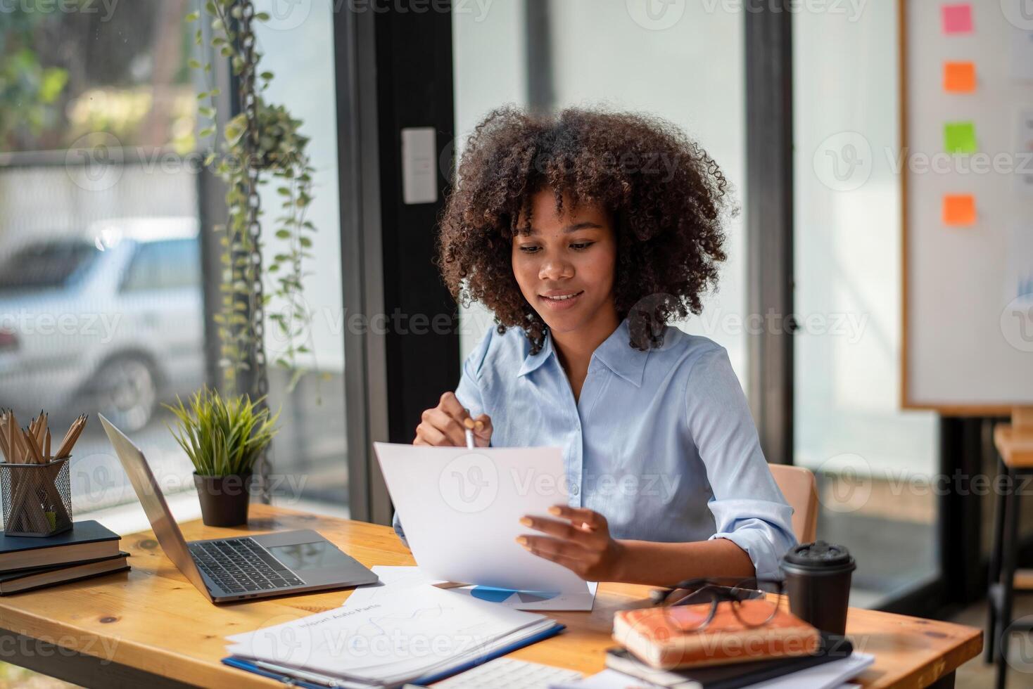 black woman working hard, work happily, Check the document work. The plan is going well, interesting story, consider the plan, photo