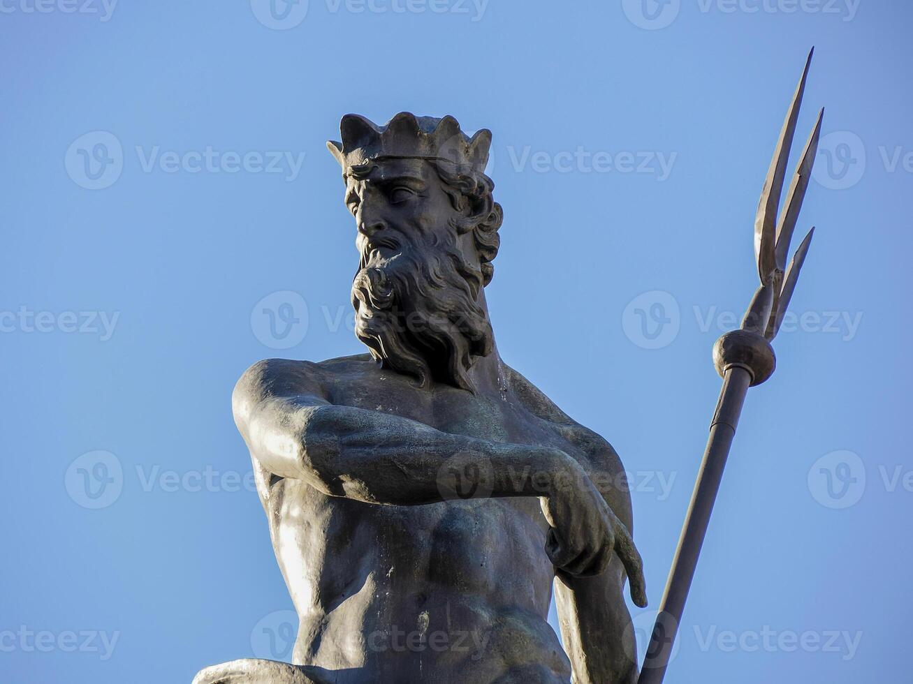 Neptune fountain in Dome place in front of the Medieval Cathedral of San Vigilio in Trento , Italy photo