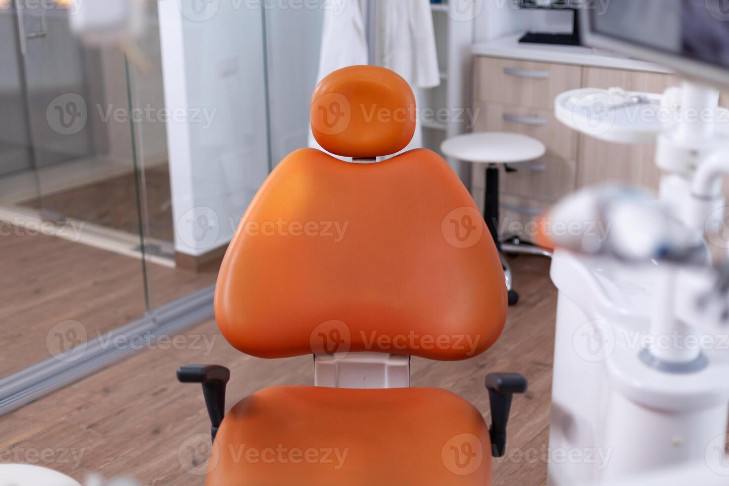 Close up view at set of dentist tools in modern dental office with nobody in it. The interior of stomatology clinic. photo