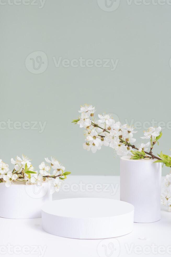 Empty podium or pedestal with spring bloom cosmetic products temlpate mockup photo