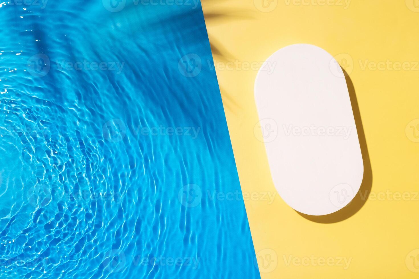 Mock up podium or pedestal flat lay on yellow background with blue water waves. photo