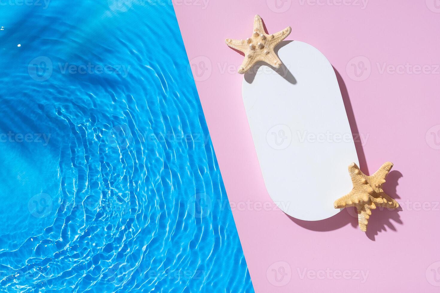 Hot summer scene mock up podium or pedestal on pink background flat lay with blue water waves photo