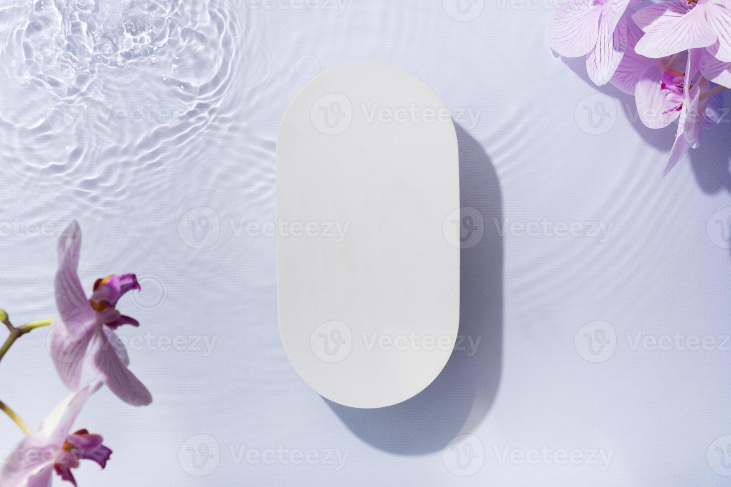 Summer cosmetic template, mockup. Empty podium or pedestal of water ripples and orchis flat lay, top view photo