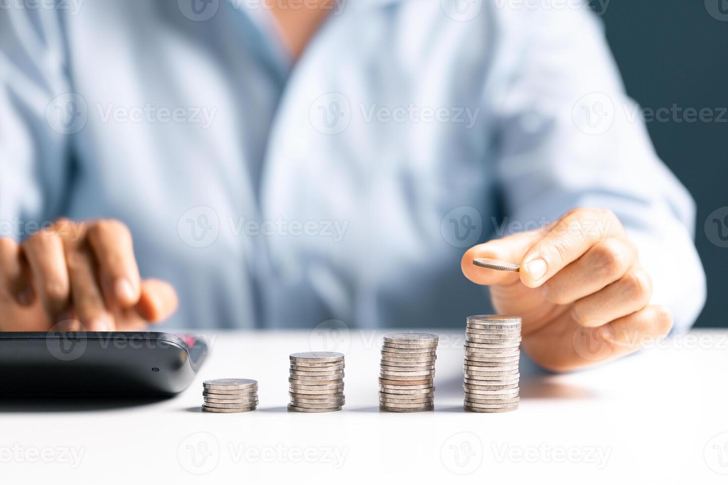 Woman with coin stack. Financial Growing savings concept. Saving money by hand putting coins money accounting planning. photo