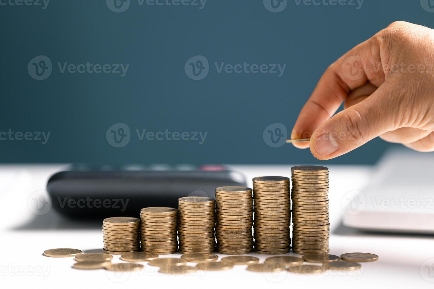 Woman with coin stack. Financial Growing savings concept. Saving money by hand putting coins money accounting planning. photo