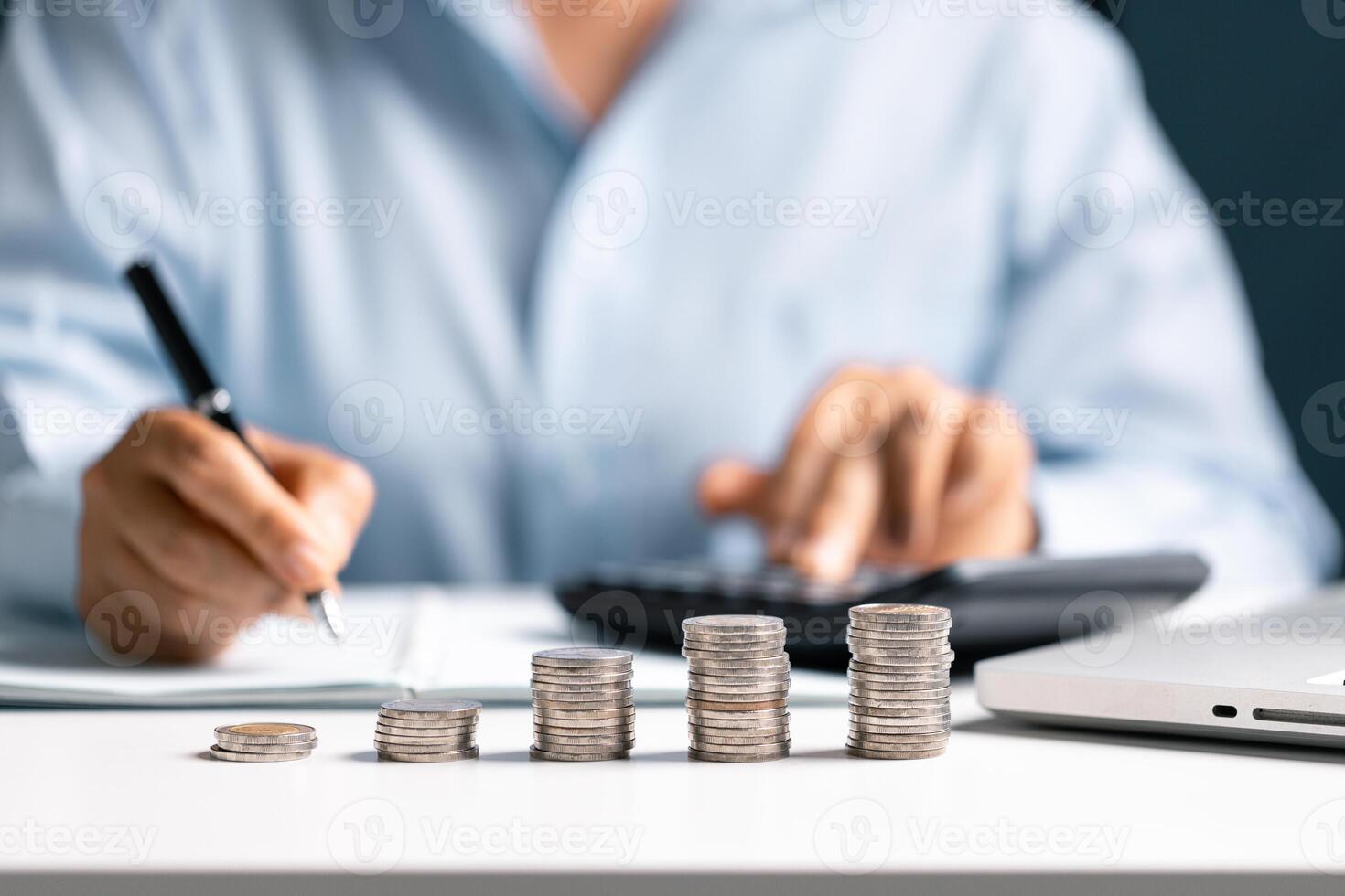Woman with coin stack. Financial Growing savings concept. Saving money by hand putting coins money accounting planning. photo